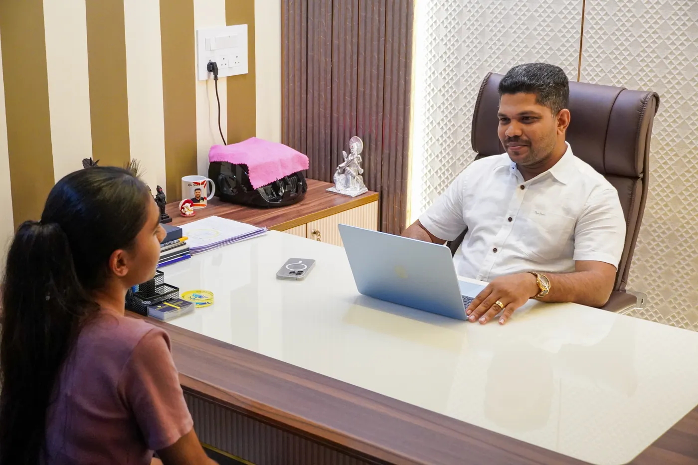 Director counseling a student one-to-one at Alchemist Academy